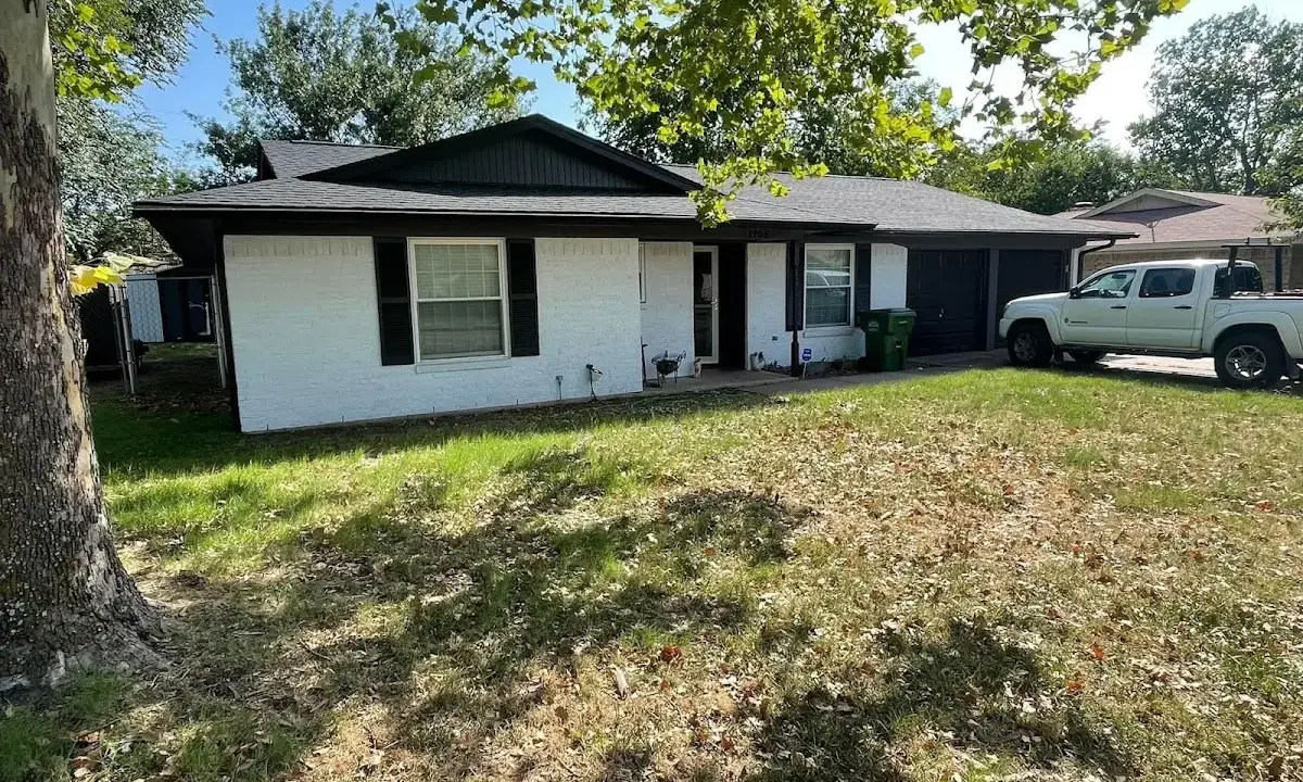Professional roofing crew working on a residential roof in Oceola